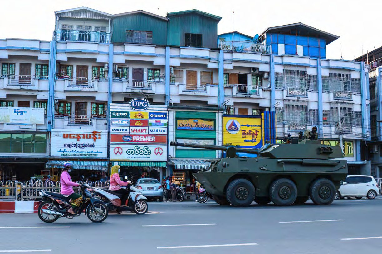 A military vehicle in a town street in Burma